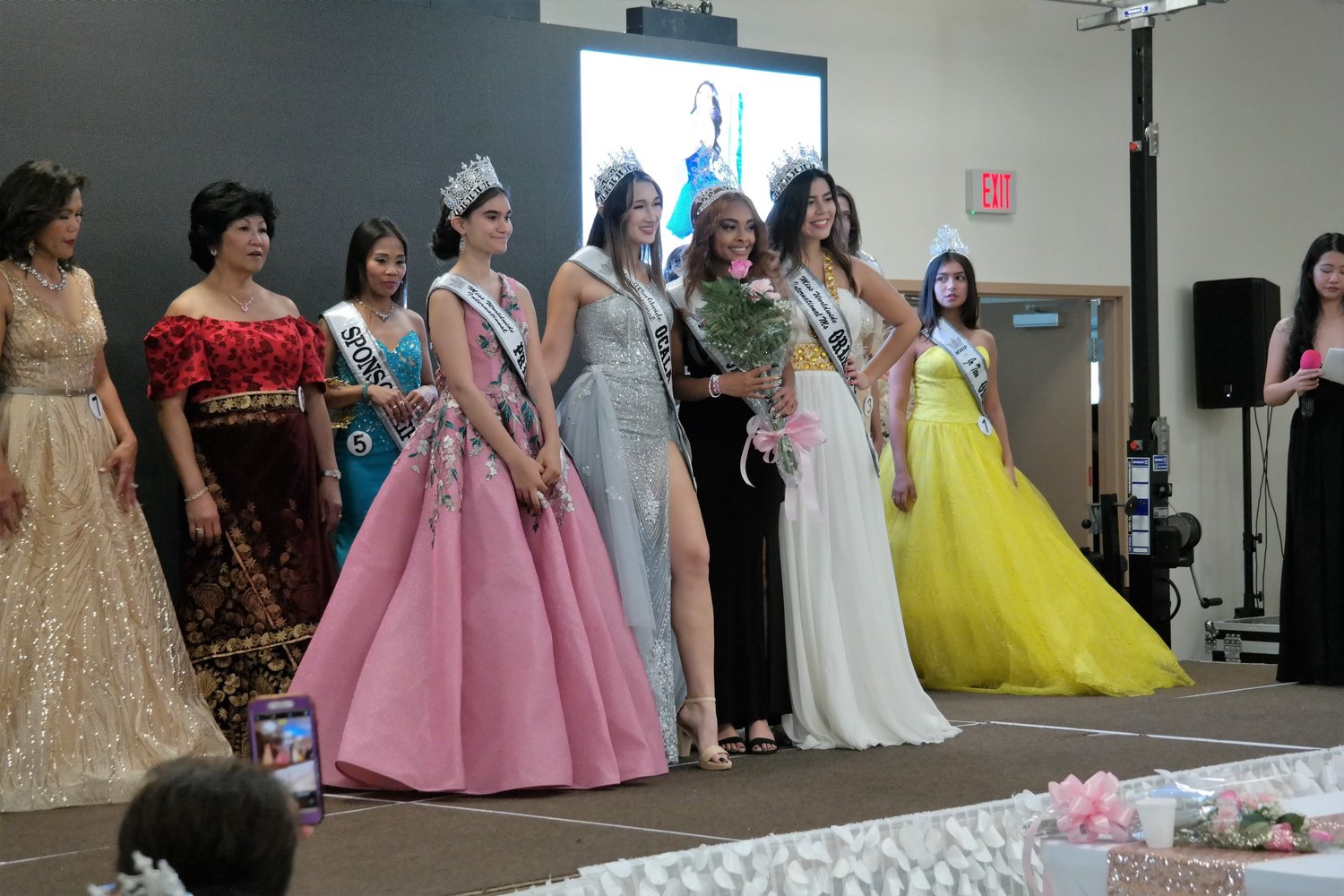 Ladies with crowned Queen Miss Syleena Lawson of Okeechobee (in black gown, front row) .